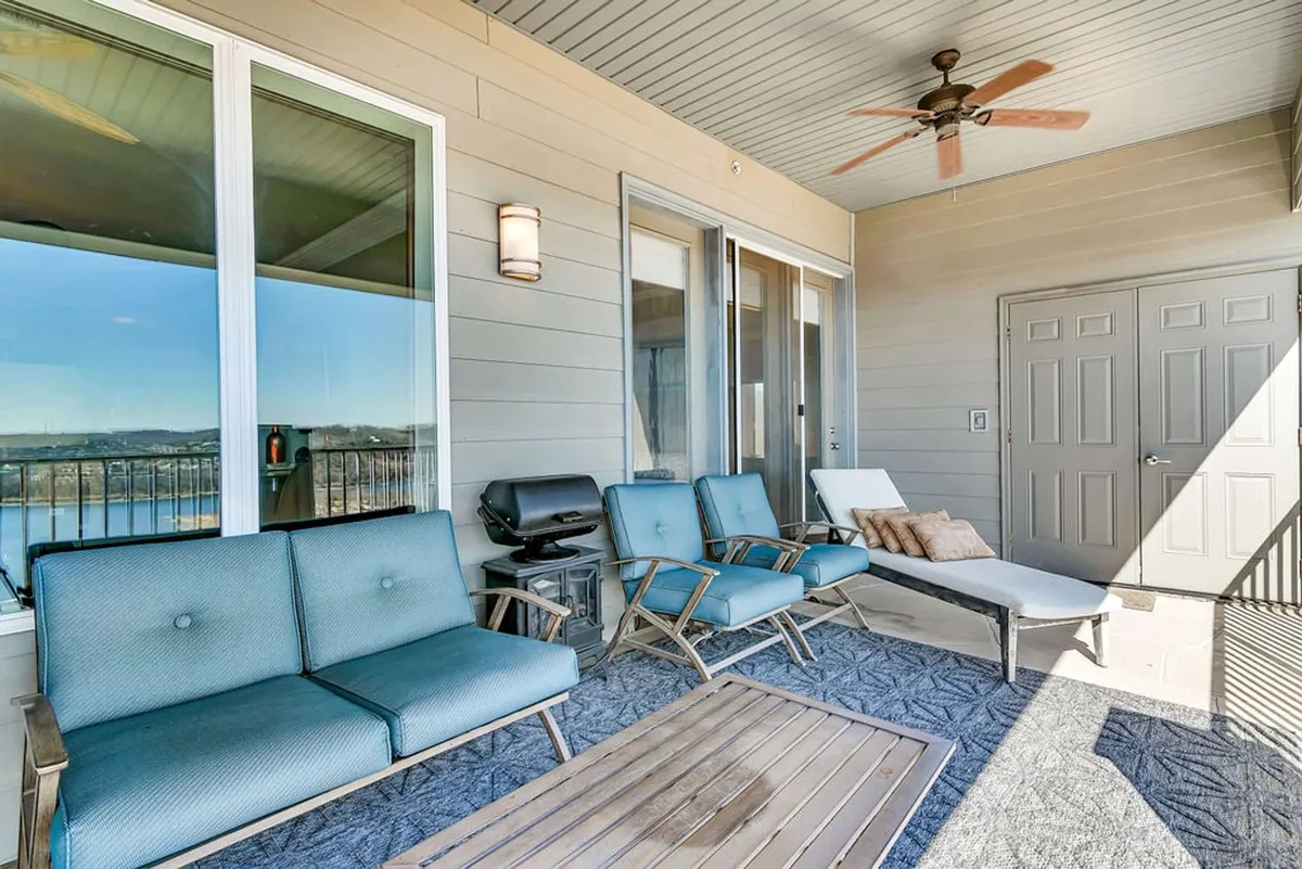 A comfortable outdoor seating area with an inviting grill setup and a stunning view of the landscape. The setting is perfect for relaxing with friends, having intimate conversations, or enjoying meals under the open sky as the sun sets.